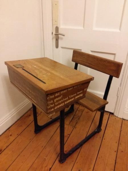 Old school desk with engraved poem