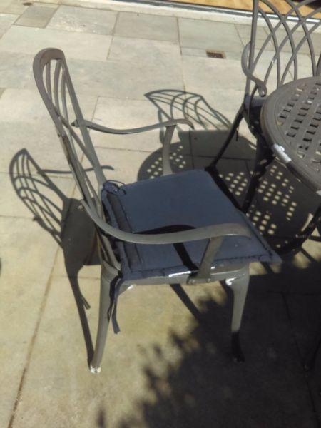 Garden Table and 4 chairs (including cushions)