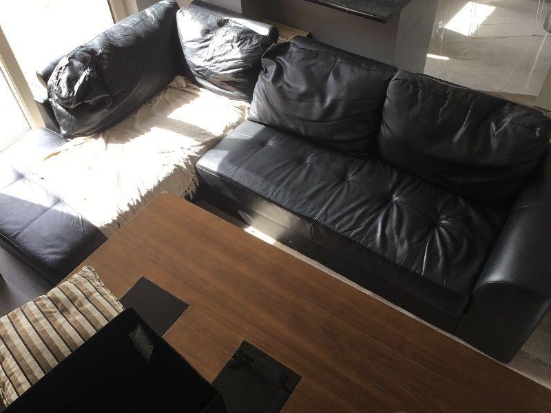 Free L shaped leatherette couch available immediately  14