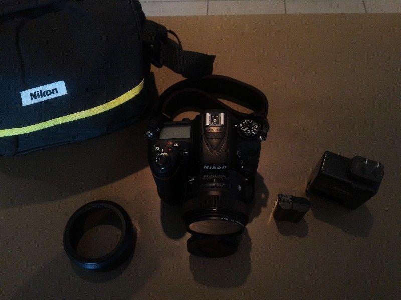nikon D7100 with Sigma Art 30mm 1.4 lens and grip for swap/trade to Fujifilm X100T or X100F