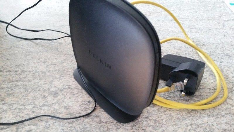 Belkin wireless router with power cable and setup cd