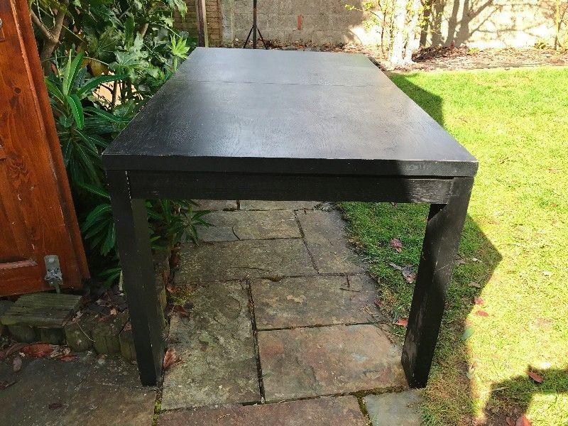 Large black wooden table - fits 6 - available to take away