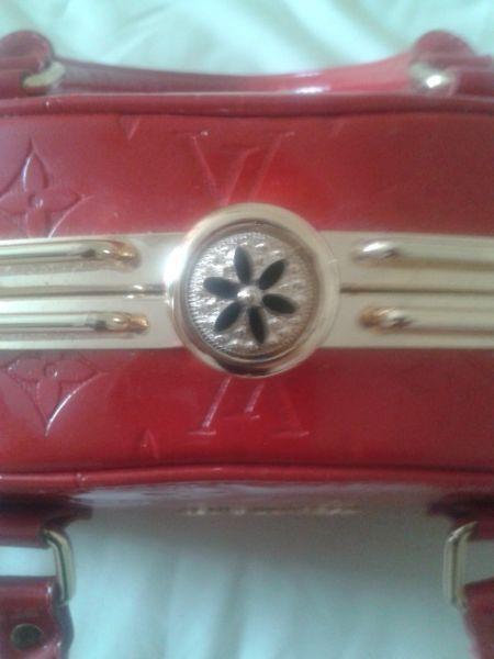 Louis vuitton bag red with gold excellent condition