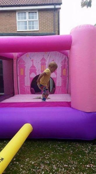 Princess bouncing castle and blue bag for storage and air pump