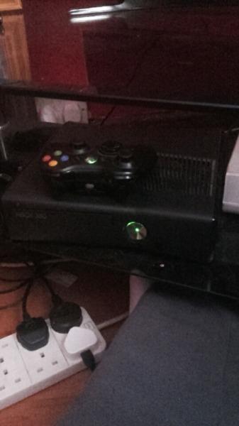 Xbox 360 and a few games and one controller and a 2 day free trail of