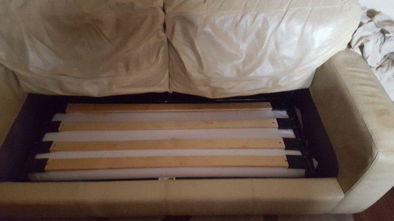 Cream leather bed settee. Good condition may suit small apartment