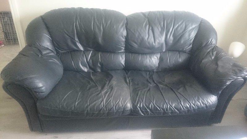 2 and 1 seater black leather couch. Sags a little in the middle. But otherwise in good condition