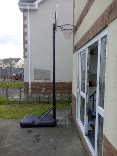 Full size, adjustable basketball stand, net and hoop + a free ball.(price is negotiable)