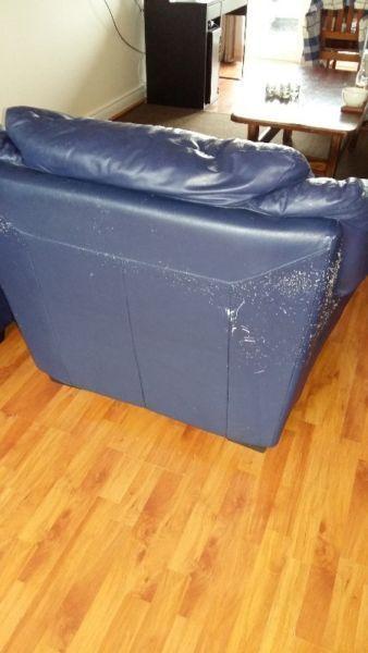 Giving dark blue used leather armchair