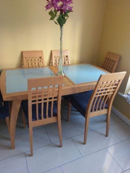 Pine kitchen table with glass in the middle and 6 chairs for sale!
