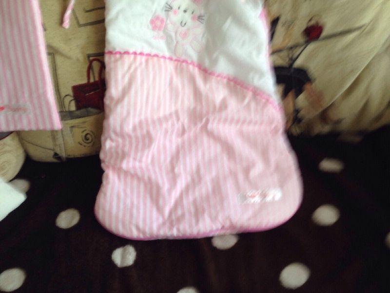 Two cot bumpers and baby sleep bag