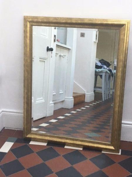 large gilt framed mirror