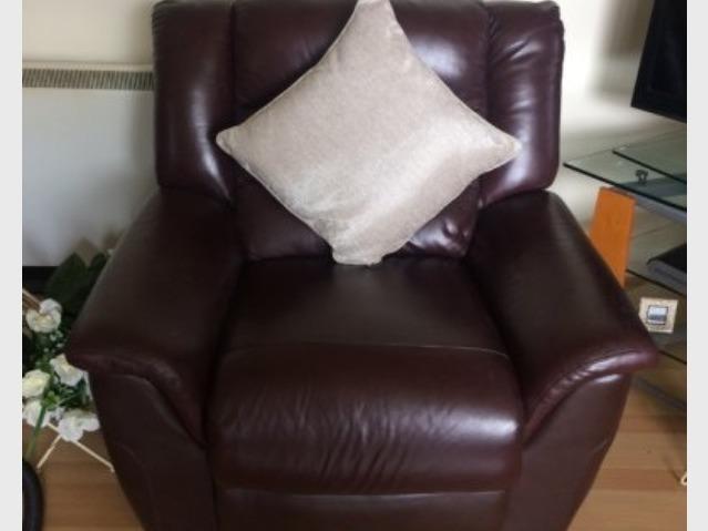 Brown leather chair next to New
