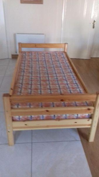 Solid pine coloured single bed