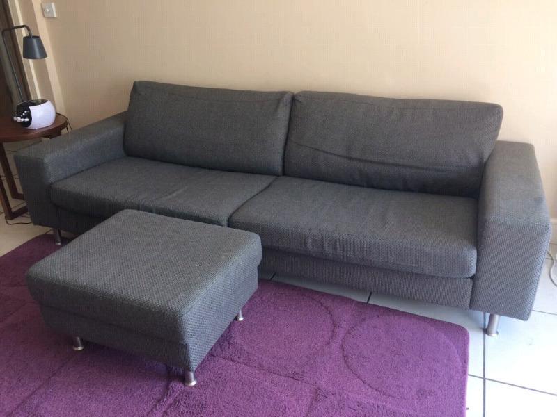 Grey 4 seater Bo Concept couch with foot stool