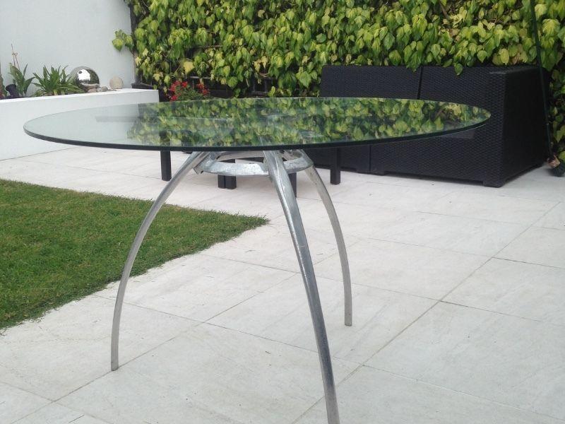 Round table with glass top and chrome legs
