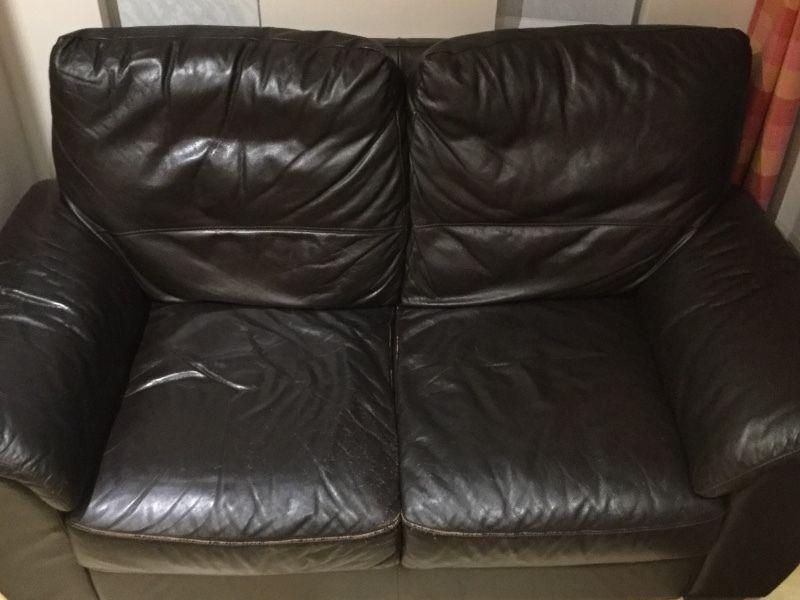 2 seater brown leather couch. Good condition