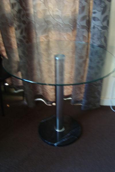 Round Glass dining table with marbel base for sale