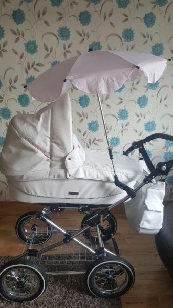 pink and white leather pram