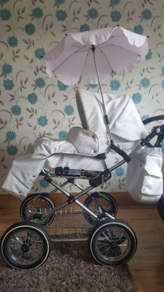 pink and white leather pram