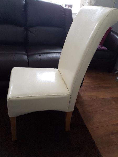 Four faux leather chairs available, excellent condition