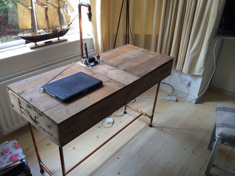 Desk repurposed from reclaimed wood & copper pipe