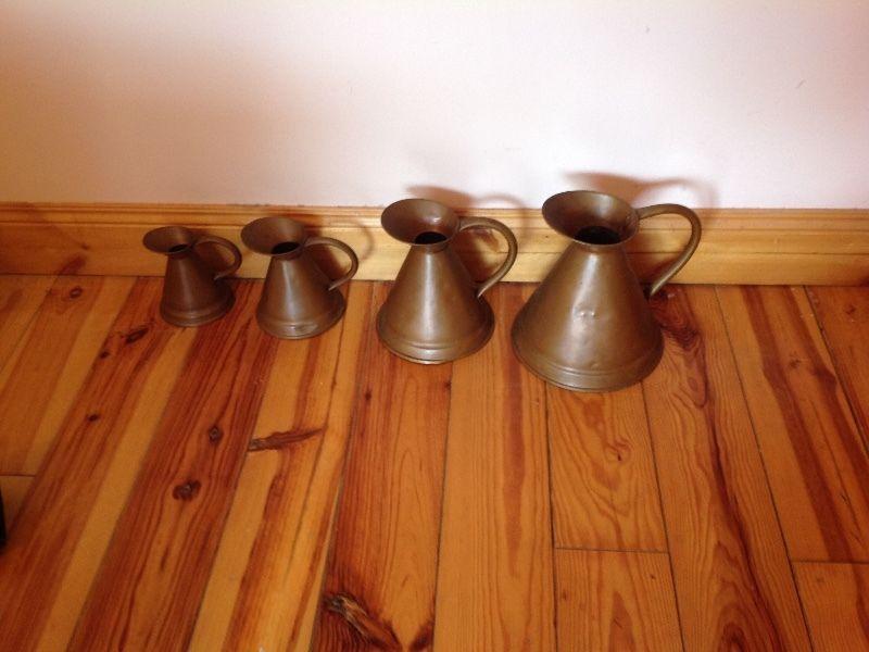 4 copper jugs