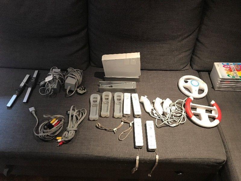 WII console with assortment of games and accessories