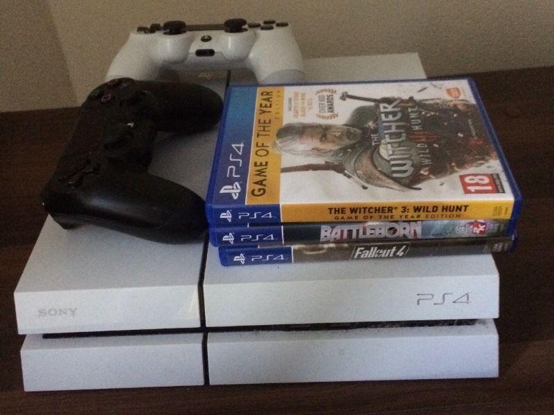 PS4 console with 2 controllers and games
