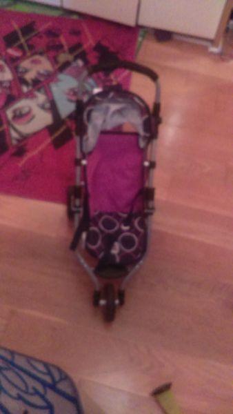 Three wheel dolls buggy in perfect condition