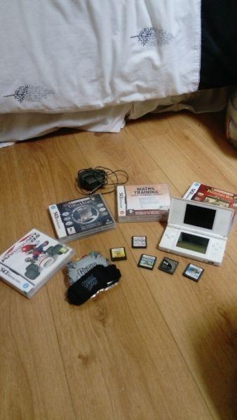 Nintendo ds with charger and games