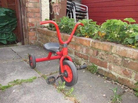 child's red trike bike