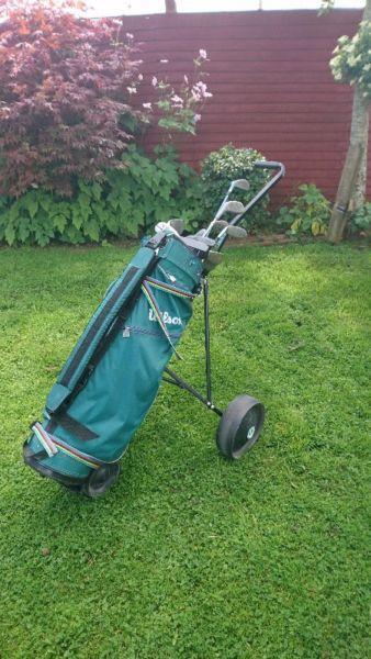 Wilson Golf bag and 14 irons, plus trolley, plus carry bag
