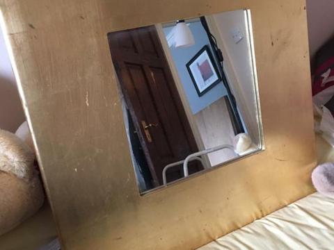 Gold coloured thick framed mirror