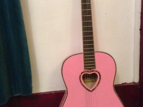 Pink child's guitar