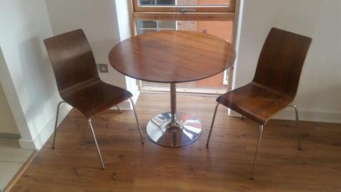 Round dining room table & two Chairs for sale