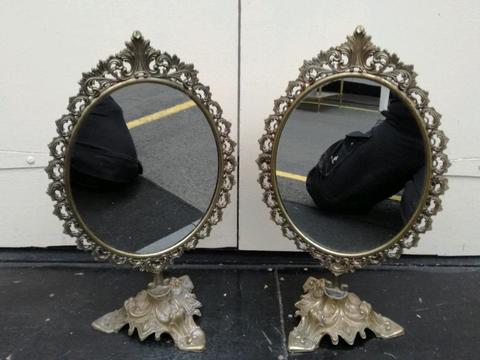 Pair of vintage cast mirrors