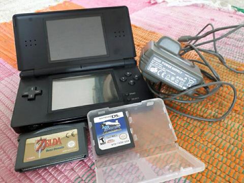 Nintendo DS Lite with stylus and Charger. One DS game. ZELDA Cartridge