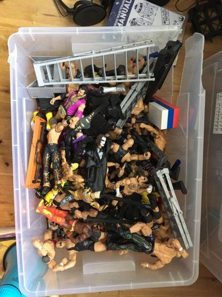 A container of WWE toys and Ring