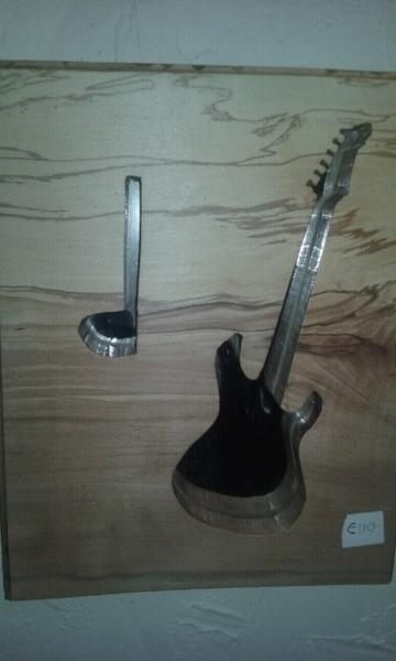 Mirror guitar and music note