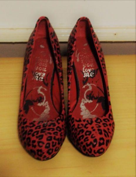 Red animal print shoes
