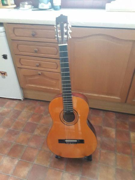 Sonora Guitar for Sale. Good for learners. Good condition. With Stand and COver