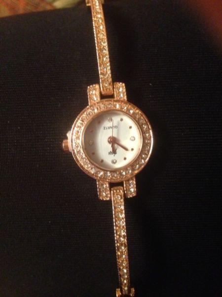 Gold coloured beautiful ladies watch