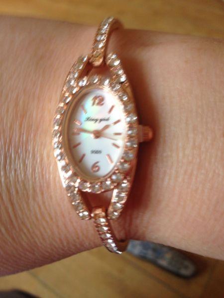 Rose gold coloured watch