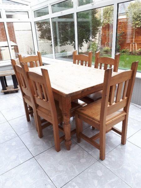 Solid Pine kitchen table with 6 matching chairs - good condition