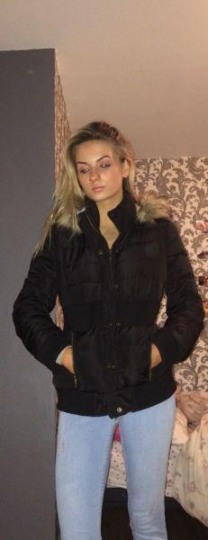 Woman’s black faux fur jacket