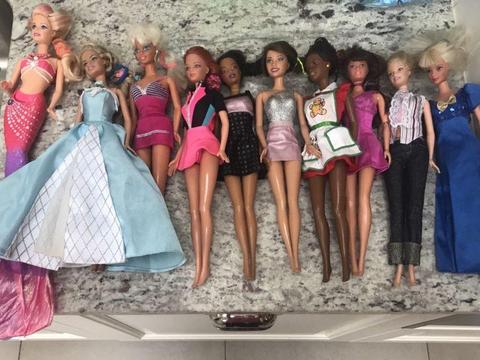 10 Barbie Dolls with huge bundle of clothes and some shoes and accessories in good condition