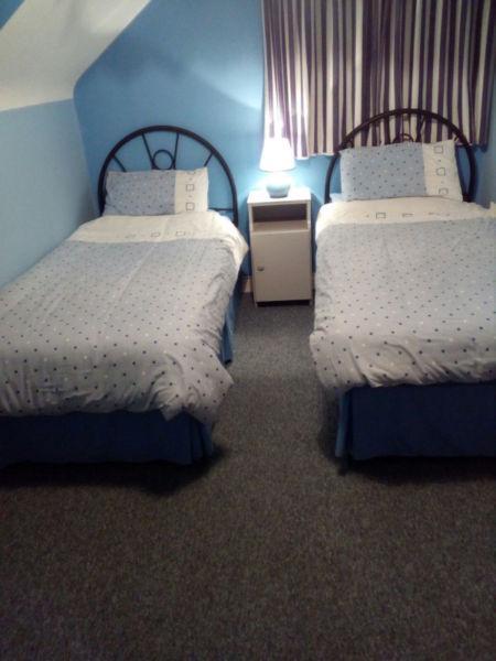 Two single beds and bed heads - quick sale