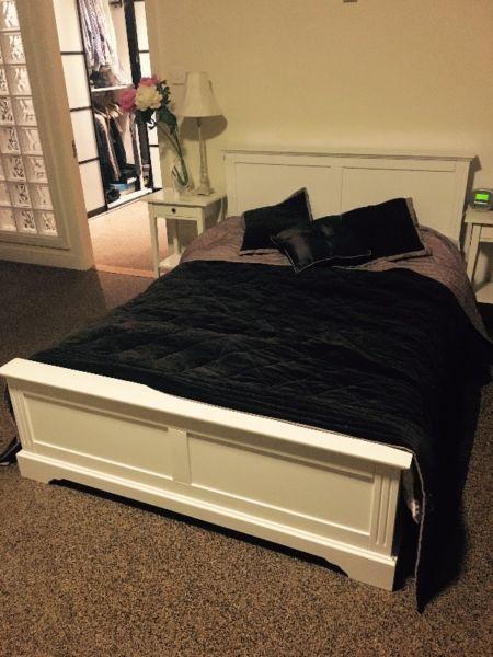 White Wooden double bed with matching side tables and dresser