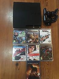 Playstation 3 with games and controller charger